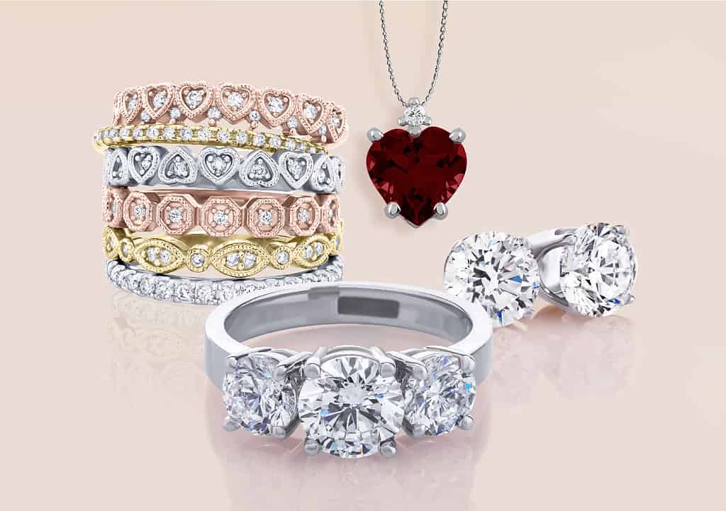 Heart pendant, stackable rings, three stone rings, and studs.