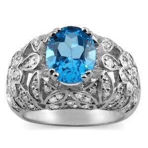 Diamond And Blue Topaz Birthstone Ring in 14k Gold